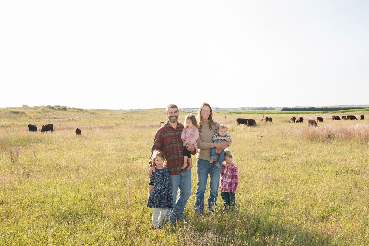 Long View Pastures owner family photo in a pasture with cattle